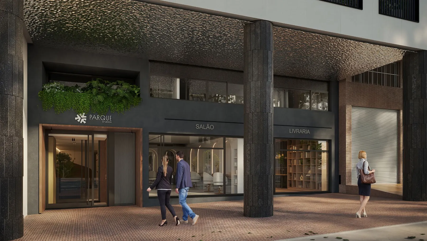 Térreo em pilotis do Parque Studios com lojas, salão e livraria sob forro de metal martelado