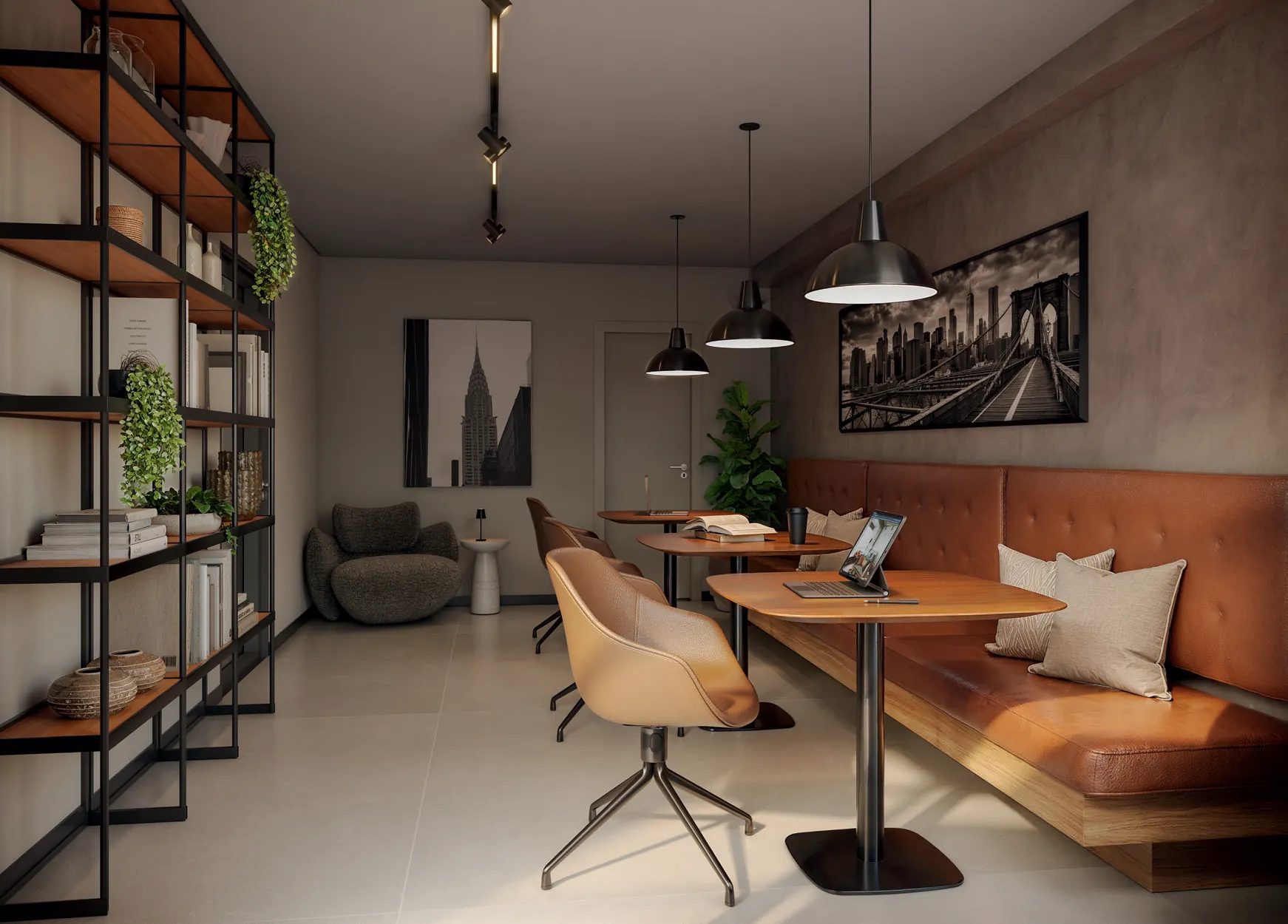 Coworking do Q Studios, no 3º pavimento, com mesas compartilhadas e estantes