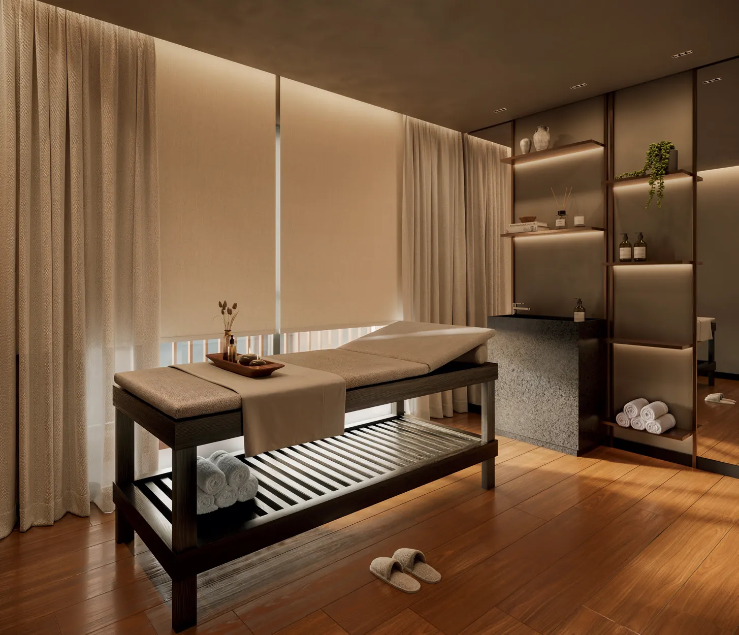 Sala de massagem do Q Studios, no 4º pavimento, com maca e iluminação indireta