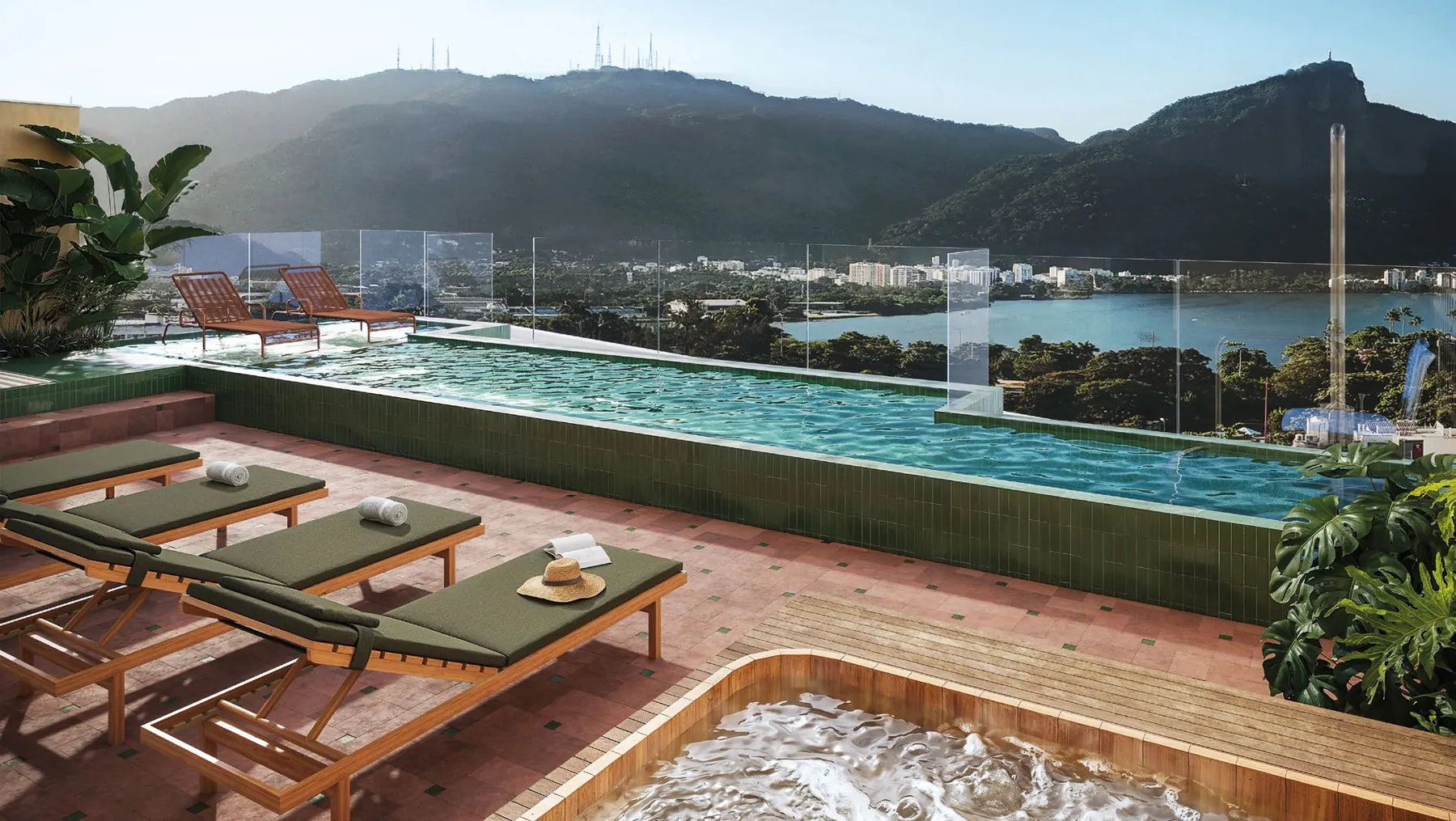 Rooftop do Parque Studios com piscina, espreguiçadeiras, jacuzzi e vista para a Lagoa